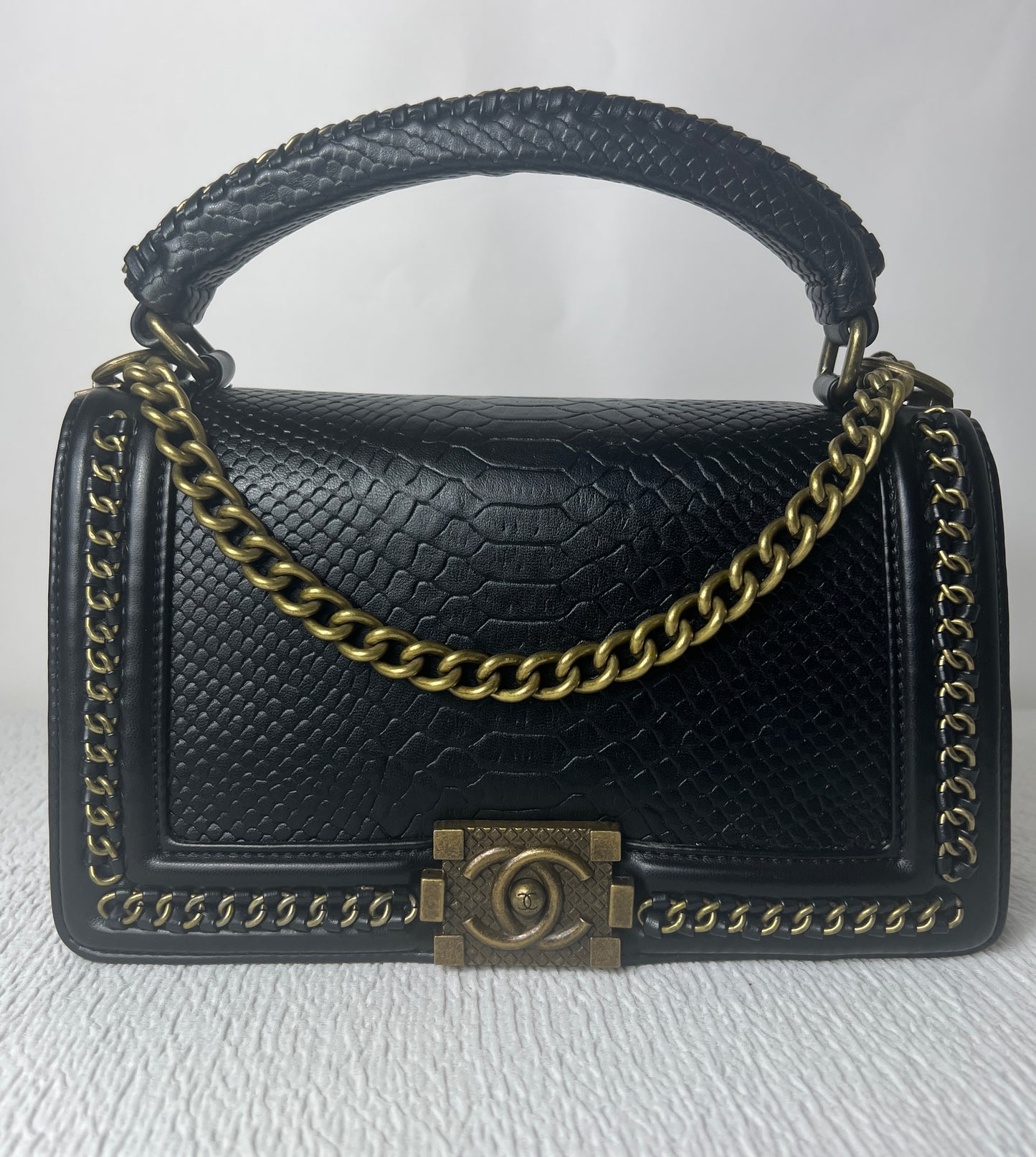 CC with snake skin imprint.
