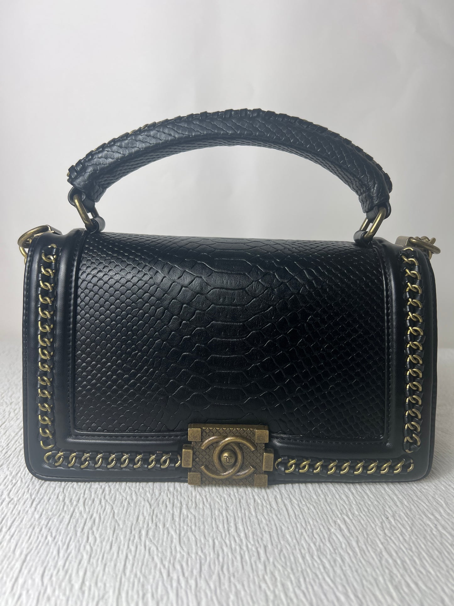 CC with snake skin imprint.