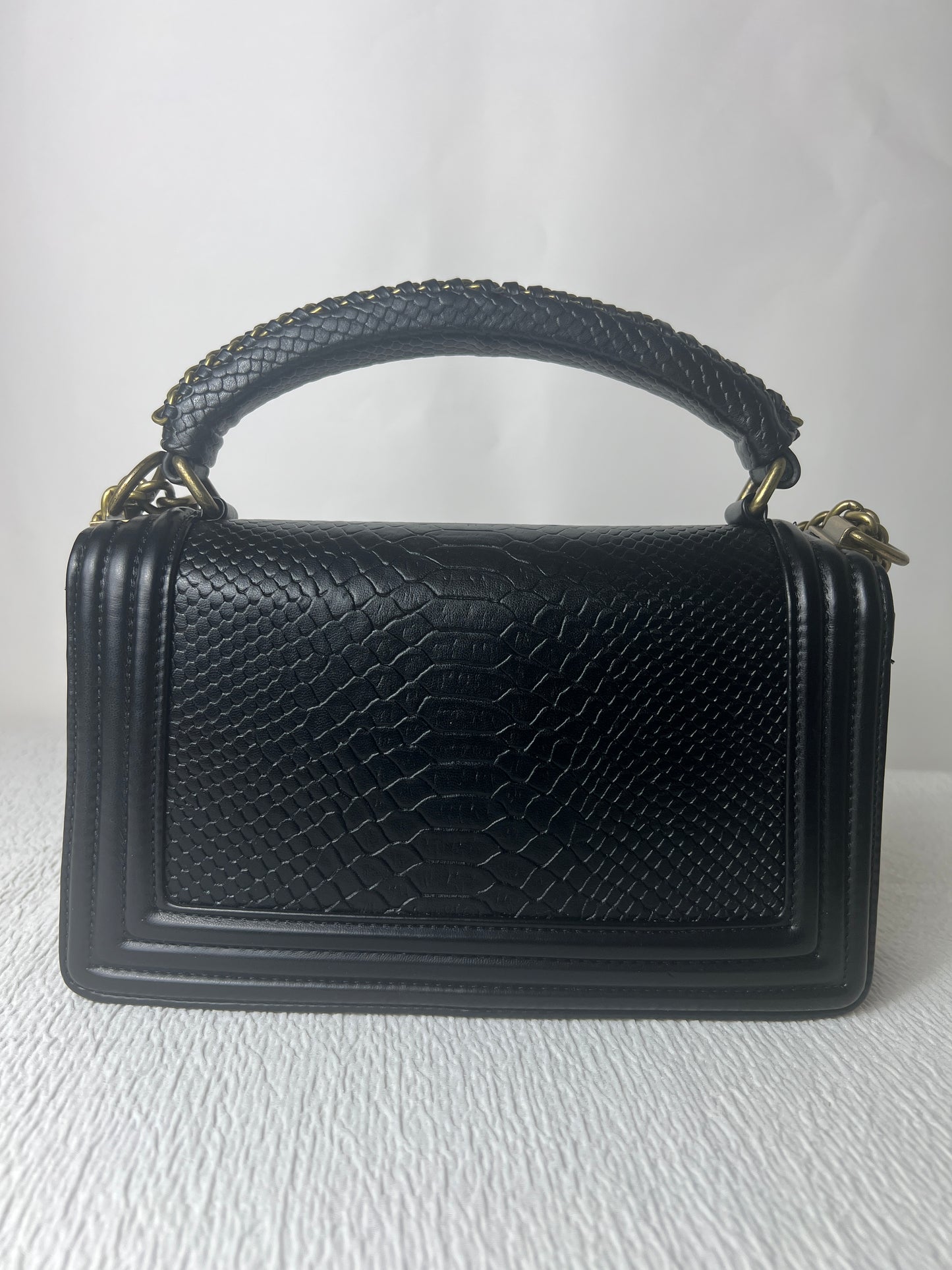 CC with snake skin imprint.